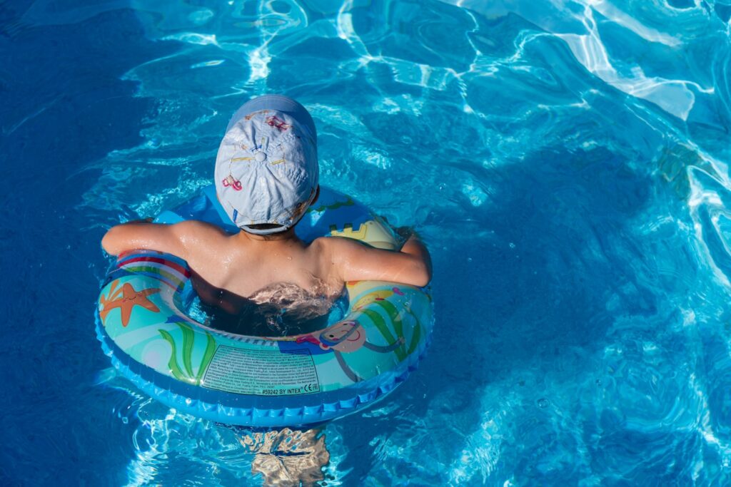 A Little boy swiming in the pool